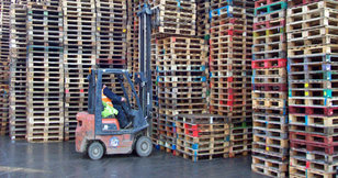 Forktruck and stacks of pallets